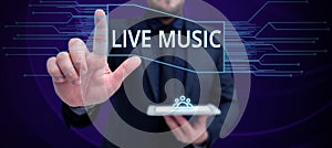 Hand writing sign Live Music. Internet Concept performance given by one or more singers or instrumentalists photo