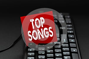 Inspiration showing sign Top Songs. Concept meaning recorded song that becomes broadly popular or wellknown Inputting