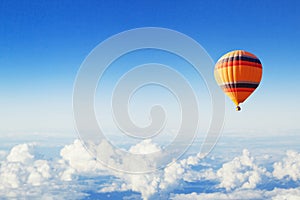 Inspiration or travel background, fly, colorful hot air balloon in blue sky