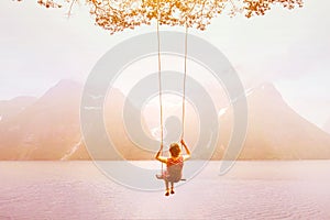 Inspiration, travel and daydream concept, beautiful young woman romantic dreamer on the swing