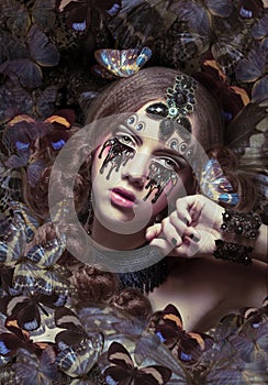 Inspiration. Woman with Fantastic Teardrops and Butterflies