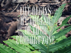 Inspirational motivating quote - life begins at the end of your comfort zone. Text with nature background.