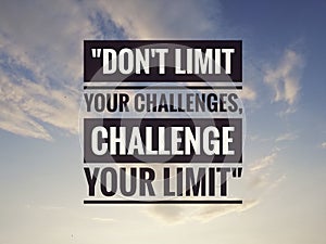 Inspirational motivating quote on nature background. Don't limit your challenges, challenge your limit.