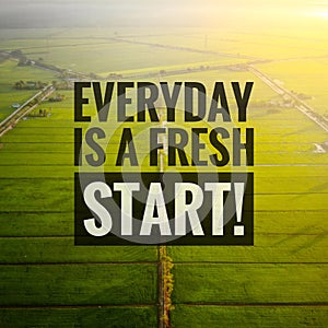 Inspirational motivating quotes on nature background. Everyday is a fresh start!