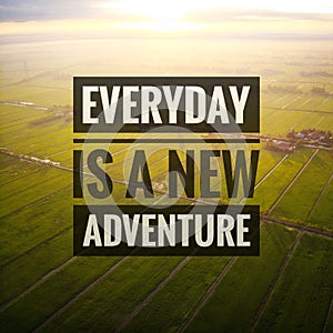 Inspirational motivating quotes on nature background. Everyday is a new adventure.