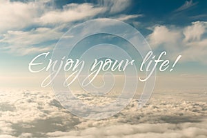 Inspirational motivation quote, enjoy life, on an abstract sky background