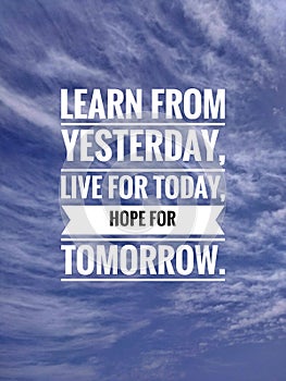 Inspirational motivation quote on natue blue sky background. Learn from yesterday, live for today, hope for tomorrow. photo