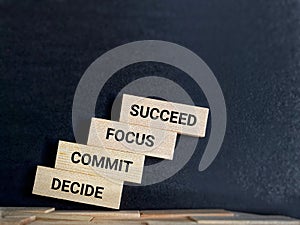 Inspirational and Motivational Concept - DECIDE COMMIT FOCUS SUCCEED text background. Stock photo.