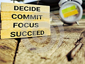 Inspirational and Motivational Concept text decide commit focus succeed background. Stock photo.