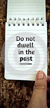 Inspirational and motivational concept. 'Do not dwell in the past' with vintage background. photo