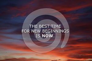 Inspirational motivational quote - The best time for new beginnings is now. Words of wisdom concept on sunset sky. photo