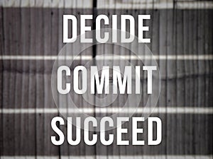Inspirational and motivational quote. Decide commit succeed text background.