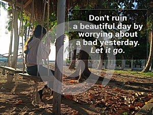 Inspirational motivational quote - Do not ruin a beautiful day worrying about a bad yesterday. Let it go. With young girl on swing