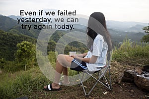 Inspirational motivational quote - Even if we failed yesterday, we can try again today. Girl sitting alone on a camp chair.