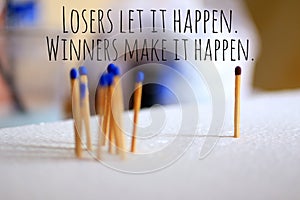 Inspirational motivational quote - Losers let it happen. Winners make it happen. Business metaphor concept with background of photo