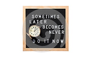 Inspirational motivational quote Sometimes later becomes never. Do it now words on a letter board with vintage alarm clock