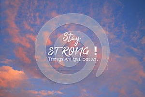 Inspirational motivational quote - Stay strong. Things will get better. Text message sign in the sky concept on bright blue sky.