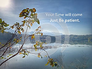 Inspirational motivational quote - You Time will come. Just Be patient. With sun morning light over beautiful nature blue lake