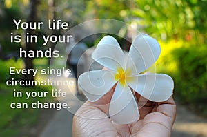 Inspirational motivational quote - Your life is in your hands. Every single circumstance in your life can change. With Bali flower