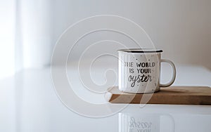 Inspirational Mug Shot: The World is Your Oyster, A Motivational Message in a Cozy Setting photo