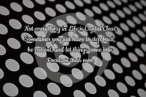 Inspirational Quote on a Black and White Polka dot background.
