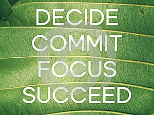 Inspirational quote - decide commit focus succeed text on green background.