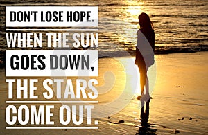 Inspirational quote - Do not lose hope. When the sun goes down, the starts come out. With young girl silhouette standing one alone