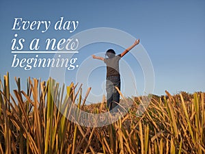 Inspirational quote - Every day is a new beginning. With background of young girl standing in field, raised hands with open arms.