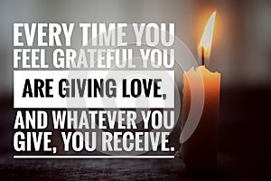 Inspirational quote - Every time you feel grateful you are giving love, and whatever you give, your receive. With a burning candle