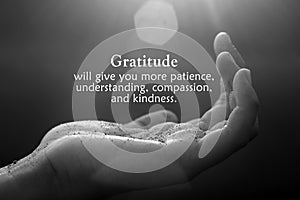 Inspirational quote - Gratitude will give you more patience, understanding, compassion, and kindness. With open palm hand photo