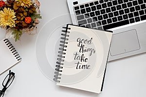 Inspirational quote handwritten in notebook. Student workspace, positive and courageous phrase