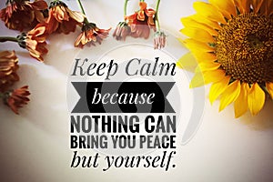 Inspirational quote - Keep calm because nothing can bring you peace but yourself. With flowers decoration on white background. photo