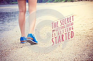 Inspirational quote poster on women`s legs running on beach