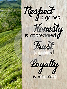 Inspirational quote - 'respect is earned honesty is appreciated trust is gained loyalty is returned'. photo