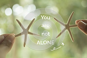 Inspirational quote `you are not alone`