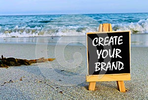 Inspirational quotes on black board - Create your brand.