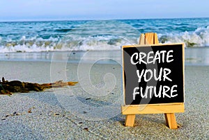 Inspirational quotes on black board - Create your future.
