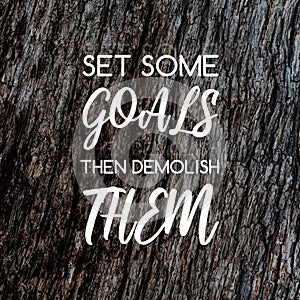 Inspirational quotes - Set some goals the demolish them. Blurry background