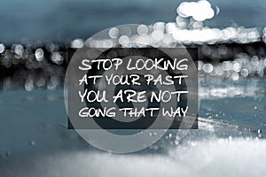 Inspirational quotes - Stop looking at your past you are not going that way. Blurry background photo