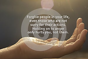 Inspirational words - Forgive people in your life, even those who are not sorry for their actions. Forgiveness concept. photo