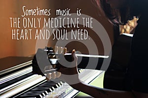 Inspirational words - Sometimes music is the only medicine the heart and soul need. With silhouette of young woman playing guitar photo