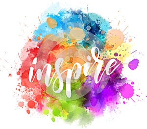 Inspire handwritten message on watercolor splash