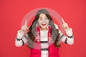 Inspired child with long curly hair in christmas aparrel. cold season activity style. childhood happiness. thermal photo