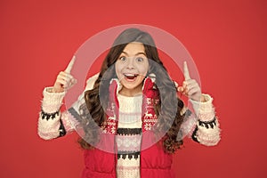 inspired child with long curly hair in christmas aparrel. cold season activity style. childhood happiness. thermal photo