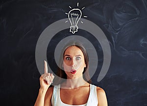 Inspired face of young woman having brainstorm