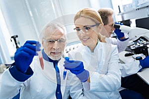 Inspired medical workers holding test tubes