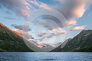 Inspiring landscape with an idyllic mountain lake during a colorful sunset in the wilderness