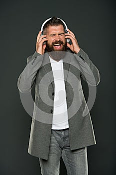 Inspiring song. Music library. Bearded guy enjoy music. Audio book. Application for listening books. Lifestyle music fan