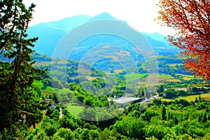 View from Montefortino at trees, thickets, buildings and the Sibillini photo