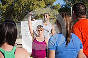 Insructor Demonstrating Kettle Bell Lifting photo